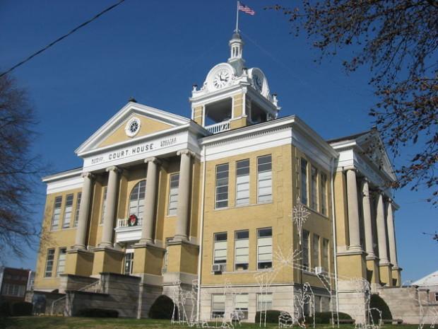 Warrick County Courthouse in Boonville, Indiana, featuring classic architecture, columns, and a clock tower, relevant to legal defense against possession charges.