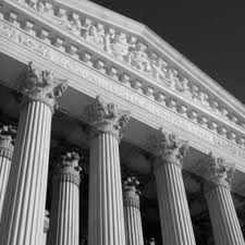 Historic courthouse architecture with ornate columns, symbolizing the legal process related to expungement of criminal records in Indiana.